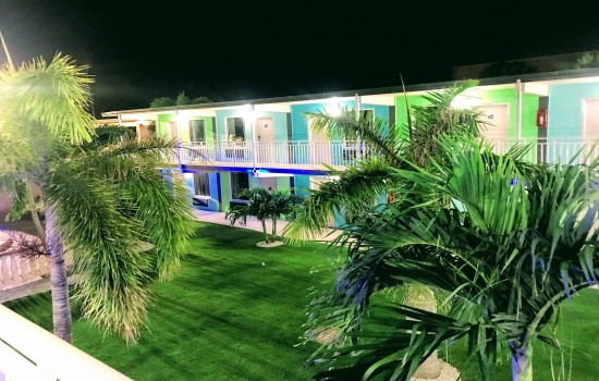 Welcome To Tropical Inn & Suites - Manicured Grounds