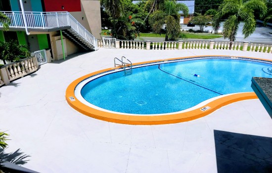Welcome To Tropical Inn & Suites - Inviting Pool